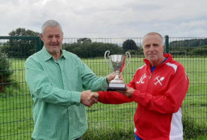 Paul receiving the trophy from John Curry, Assistant Secretary