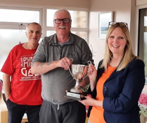 Jane Brown being presented with Trophy